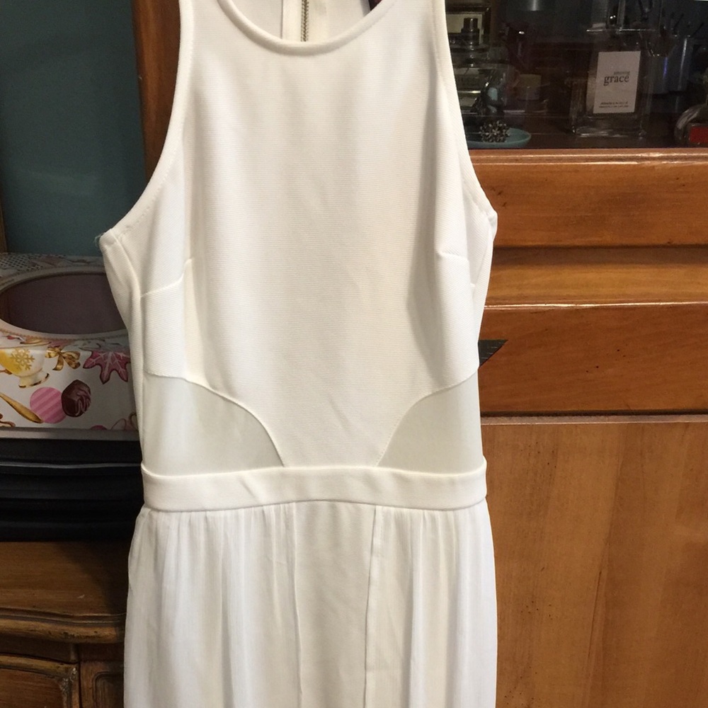 White mini dress with wide flowing panel flaps